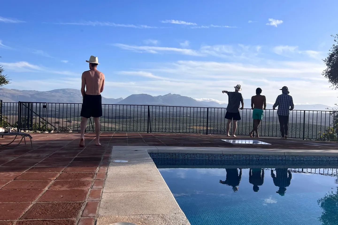 Brothers by the pool looking out over the mountains