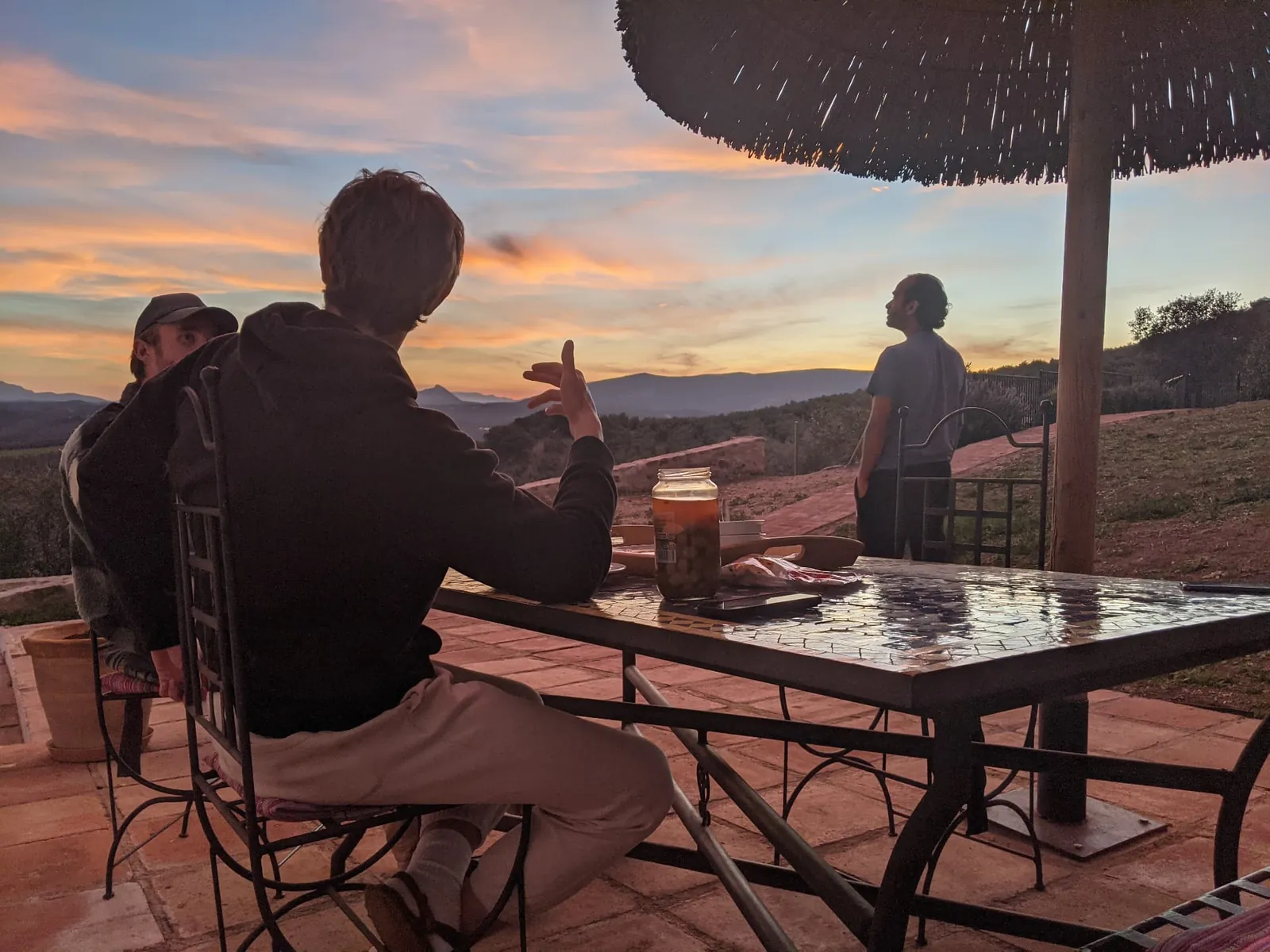Conversation on the terrace at sunset